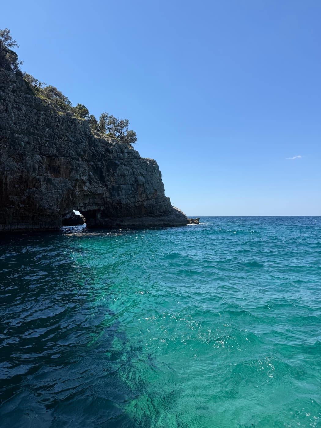 Cave entrance with turquoise water